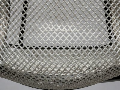 Close up of high-tension elastomeric chair mesh